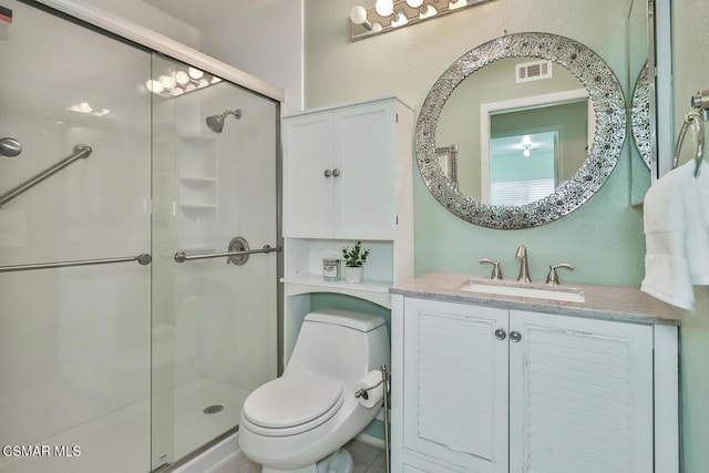 bathroom with vanity, toilet, and walk in shower