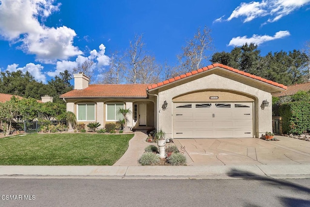 mediterranean / spanish-style home featuring a garage and a front yard