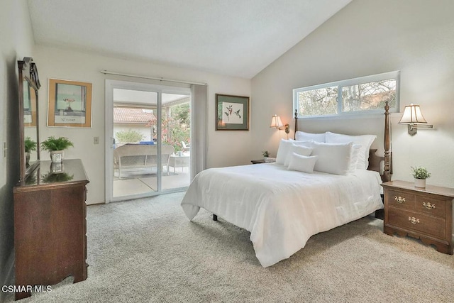 bedroom featuring light colored carpet, multiple windows, access to exterior, and lofted ceiling