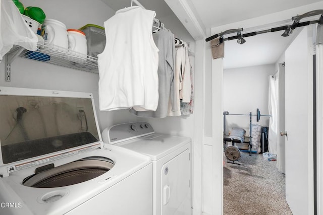 laundry area with independent washer and dryer and carpet floors