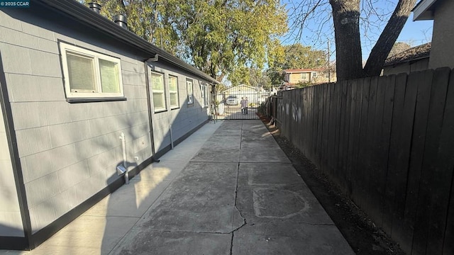 view of side of property featuring a patio area