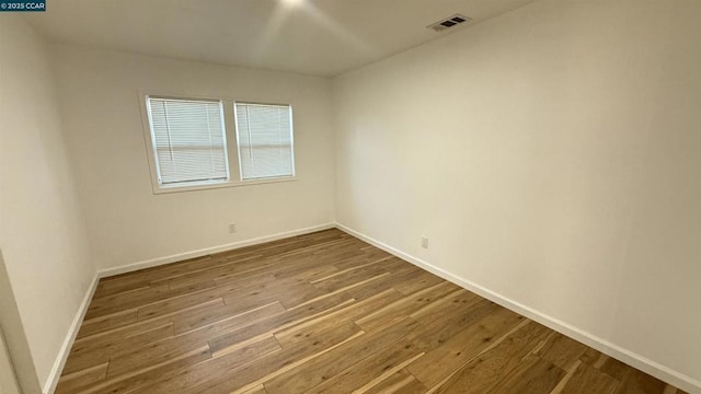 empty room featuring hardwood / wood-style flooring