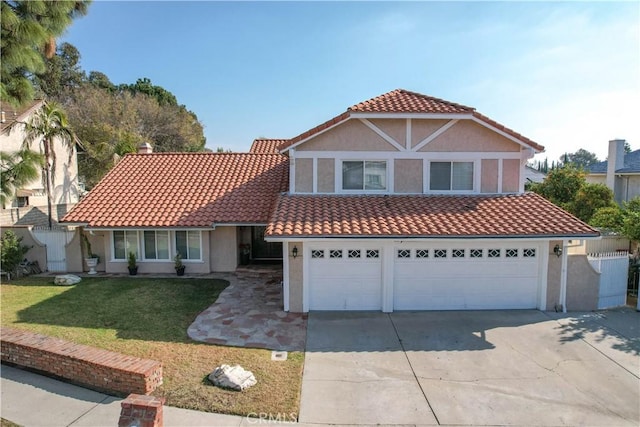 mediterranean / spanish-style house featuring a front lawn and a garage