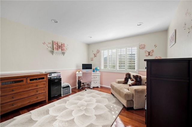 bedroom with dark wood-type flooring