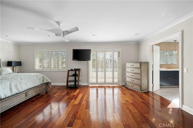 bedroom with ceiling fan, dark wood-type flooring, connected bathroom, and ornamental molding