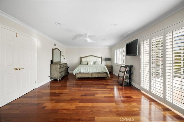 bedroom with ceiling fan, dark hardwood / wood-style floors, and multiple windows