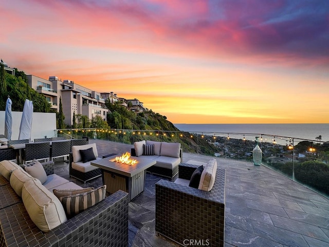 1380 Skyline Dr, Laguna Beach, CA 92651 - view of patio with an outdoor living space with a fire pit and a water view