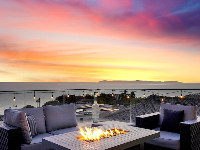 1380 Skyline Dr, Laguna Beach, CA 92651 - deck at dusk with an outdoor fire pit and a water view