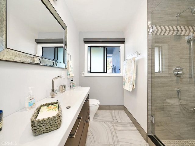 bathroom featuring toilet, vanity, an enclosed shower, and tile patterned flooring