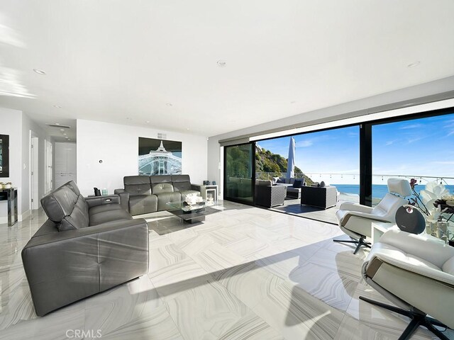 living room featuring a water view