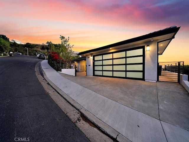 1380 Skyline Dr, Laguna Beach, CA 92651 - contemporary home featuring concrete driveway, stucco siding, and a garage