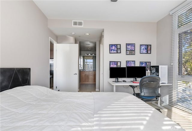 bedroom featuring ensuite bath