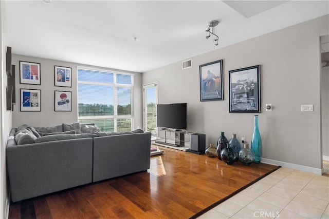 living room with light hardwood / wood-style flooring