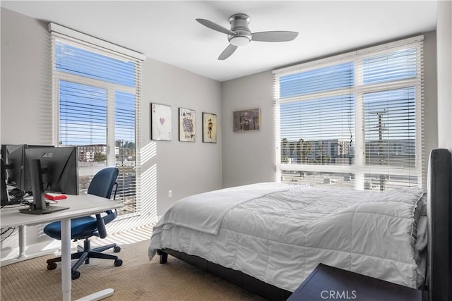 bedroom featuring ceiling fan and carpet flooring