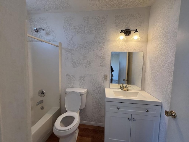 full bathroom featuring toilet, shower / washtub combination, hardwood / wood-style flooring, and vanity