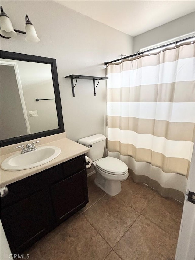 66263 6th St, Desert Hot Springs, CA 92240 - full bathroom with curtained shower, vanity, tile patterned flooring, and toilet