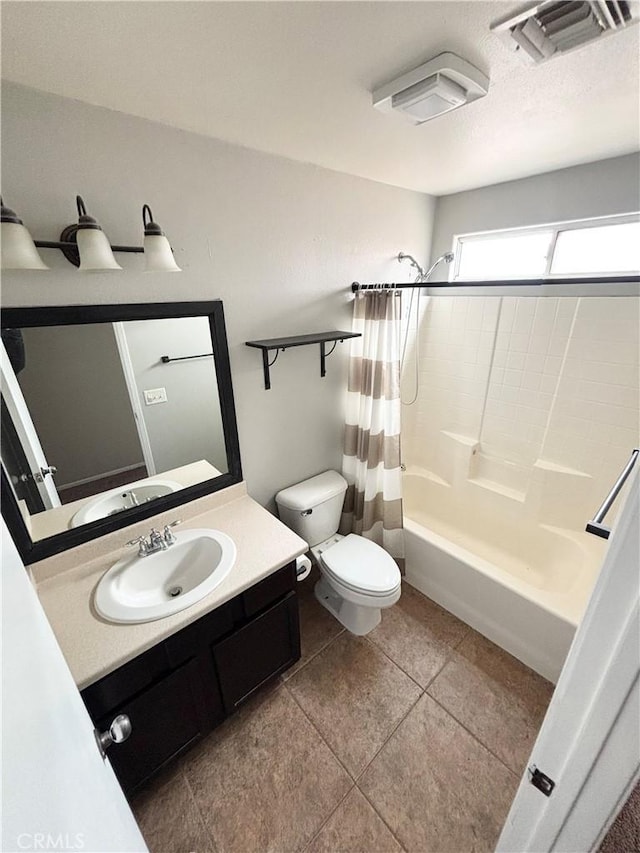 full bathroom featuring tile patterned flooring, shower / bath combo, vanity, and toilet