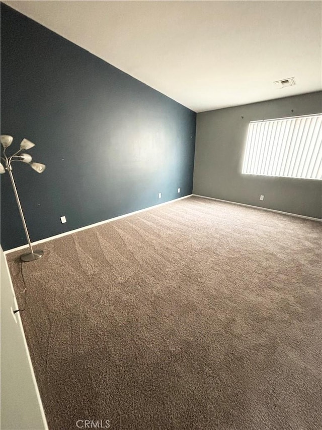 66263 6th St, Desert Hot Springs, CA 92240 - unfurnished room featuring baseboards, visible vents, and carpet