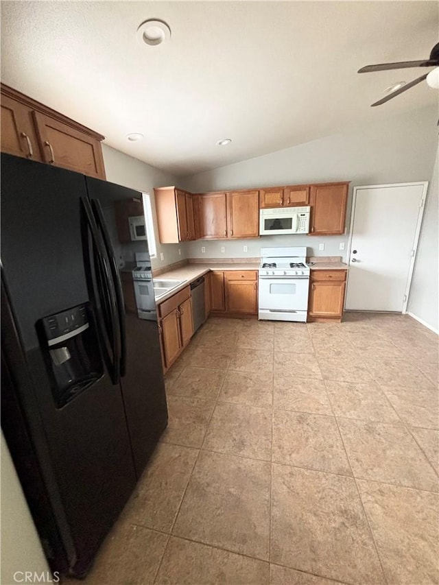 66263 6th St, Desert Hot Springs, CA 92240 - kitchen featuring vaulted ceiling, white appliances, ceiling fan, light countertops, and light tile patterned floors