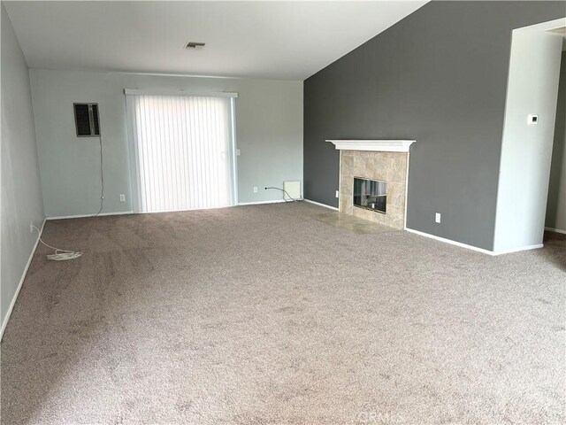 66263 6th St, Desert Hot Springs, CA 92240 - unfurnished living room with carpet floors, a tiled fireplace, baseboards, and visible vents