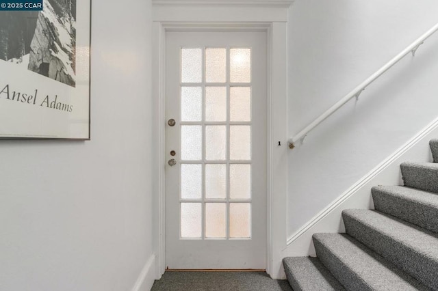 doorway to outside with carpet