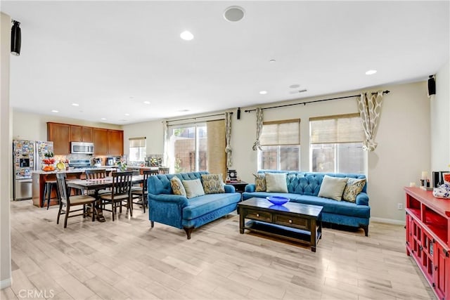 living room with light hardwood / wood-style flooring