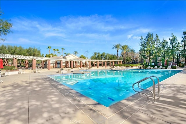 view of pool featuring a pergola and a patio