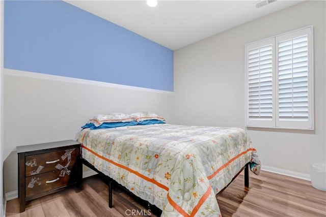 bedroom featuring hardwood / wood-style flooring