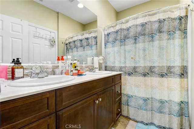 bathroom featuring walk in shower, tile patterned floors, and vanity