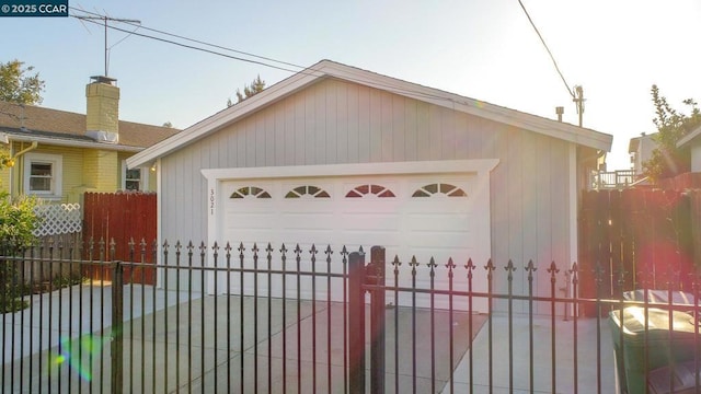 view of front of home featuring a garage and an outdoor structure