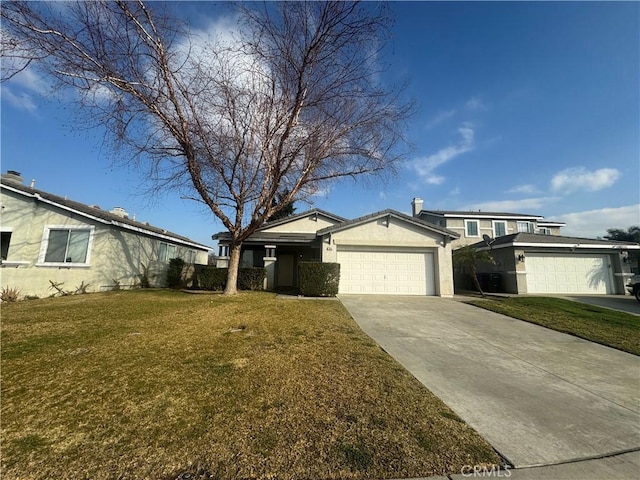 view of front of house with a front yard and a garage