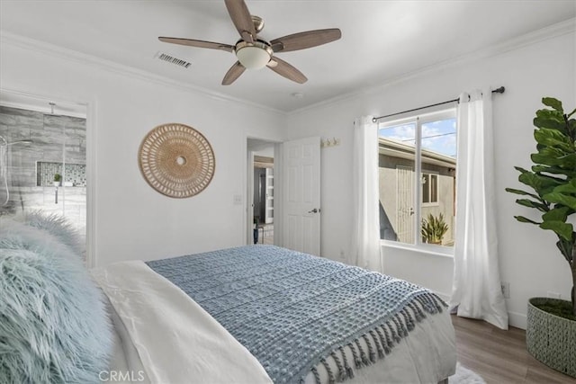 bedroom featuring ceiling fan, hardwood / wood-style flooring, and crown molding