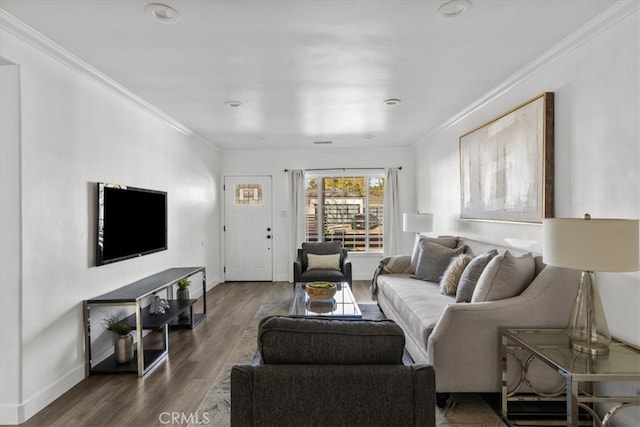 living room with dark hardwood / wood-style flooring and crown molding