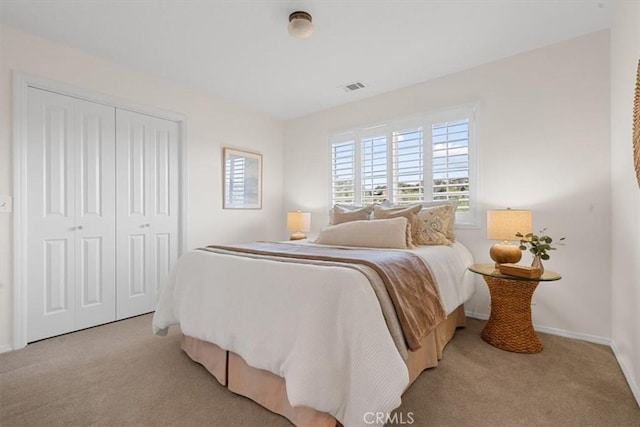 carpeted bedroom featuring a closet