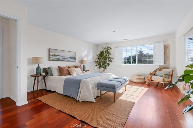 bedroom with hardwood / wood-style flooring