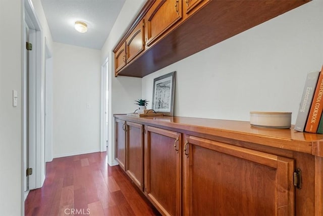 hall featuring dark wood-type flooring