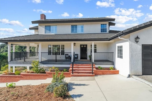 view of property featuring a porch