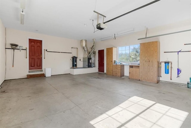 garage featuring a garage door opener and heating unit