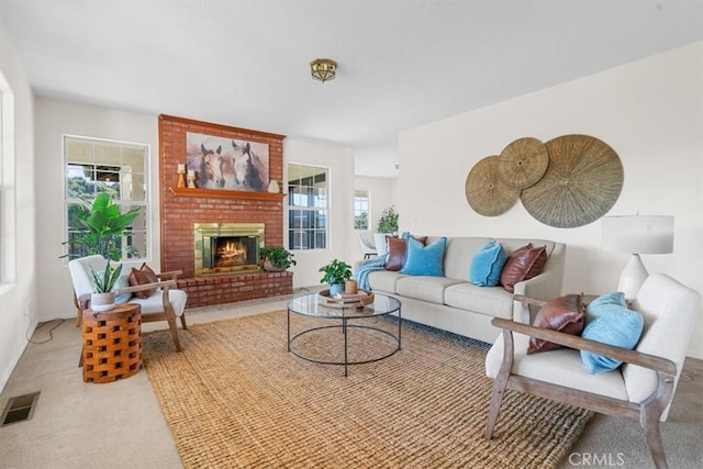 living room featuring a brick fireplace and carpet flooring