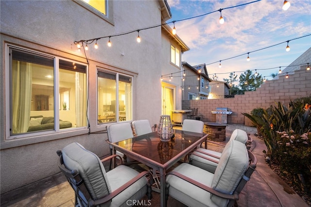 view of patio terrace at dusk