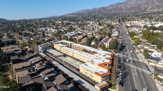 birds eye view of property with a mountain view