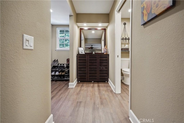 hallway featuring light wood-type flooring