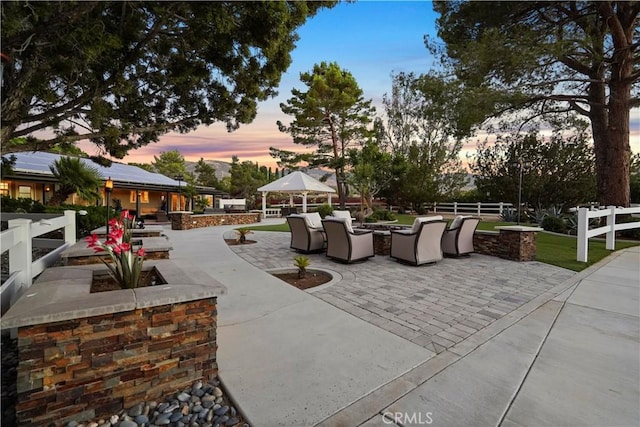 patio terrace at dusk with a gazebo