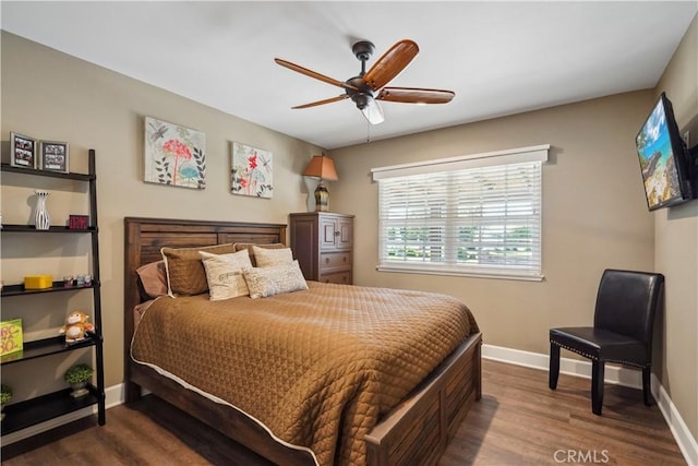 bedroom featuring ceiling fan and dark hardwood / wood-style floors