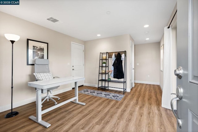 office space with light hardwood / wood-style flooring