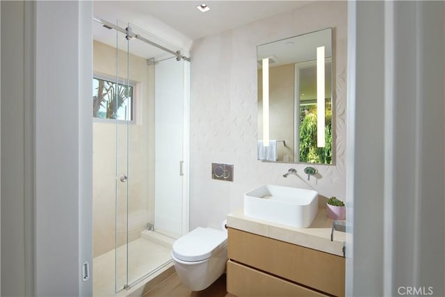 bathroom with vanity, an enclosed shower, and toilet