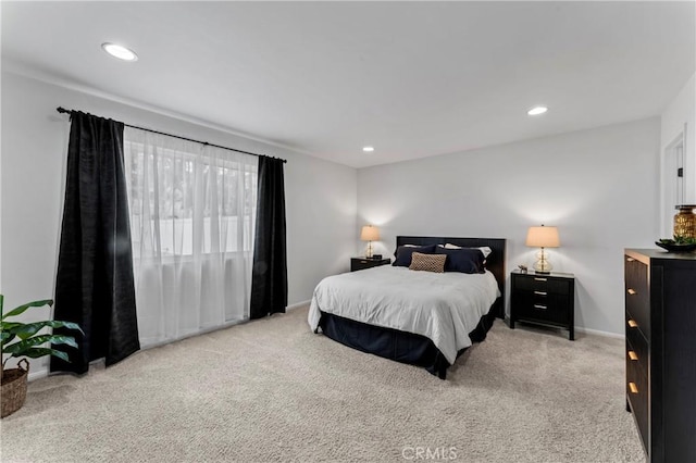 bedroom featuring light carpet