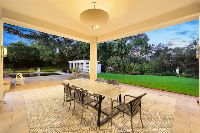 patio terrace at dusk with a lawn