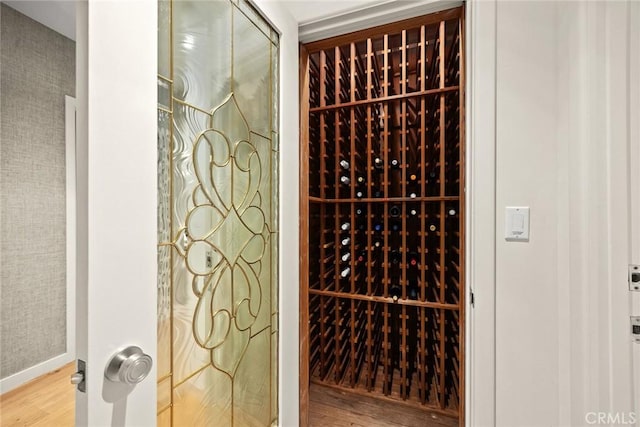 wine cellar featuring hardwood / wood-style flooring