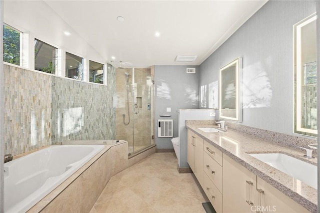 full bathroom with plenty of natural light, toilet, vanity, and independent shower and bath